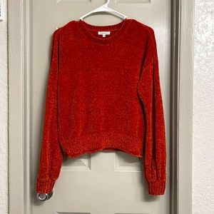 Bishop sleeve solid sweater. Color: terracota. Round neck. Material: polyester.